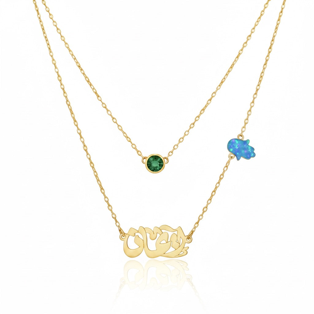 Gold necklace with gemstones on a white background