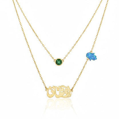 Gold necklace with gemstones on a white background