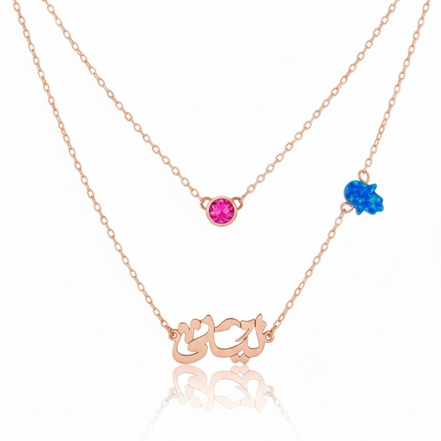Rose gold necklace with gemstones on a white background