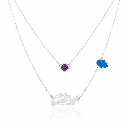 Silver necklace with purple and blue gemstones on a white background