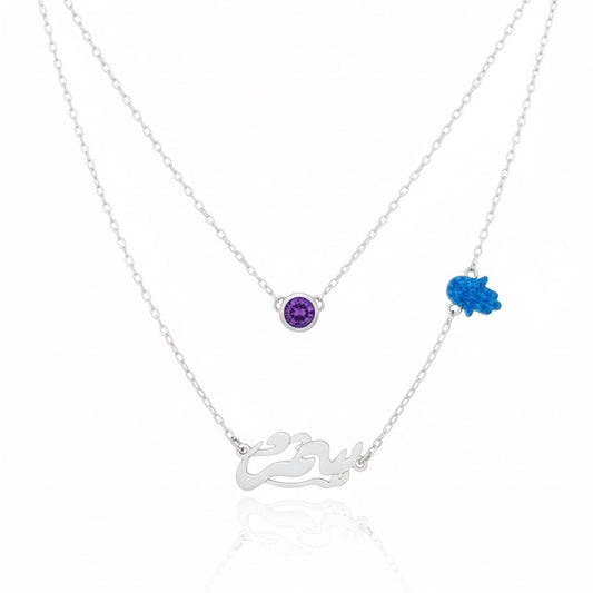 Silver necklace with purple and blue gemstones on a white background